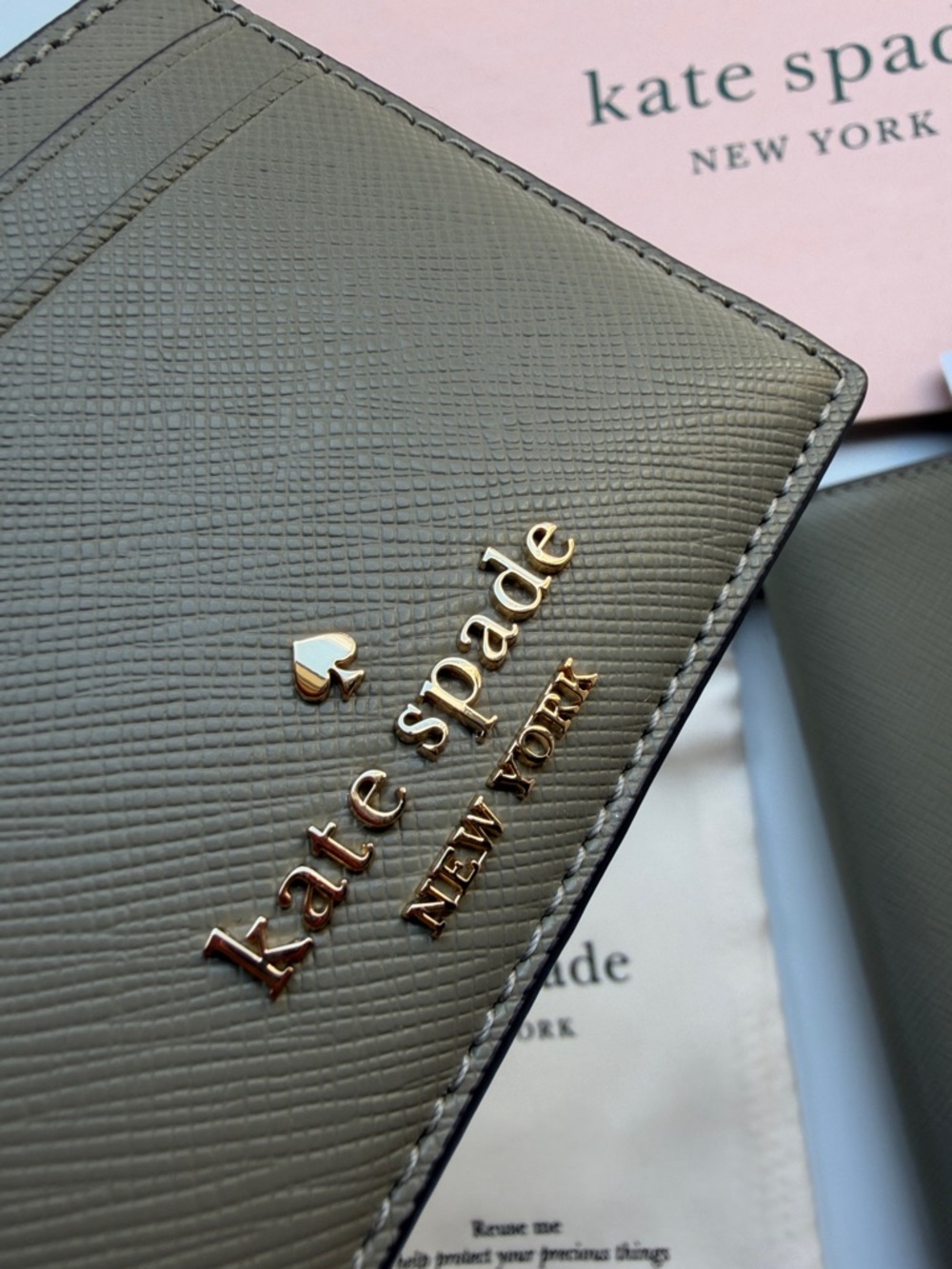 kate spade card holder & passport wallet with gold logo in oyster shell color - Picture 13 of 14